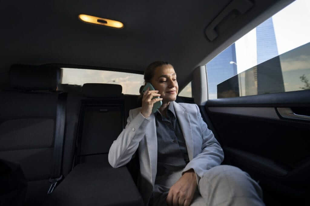 man seating in a luxury car enjoying luxury ride